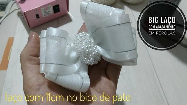 Big laço com acabamento chuva de pérolas