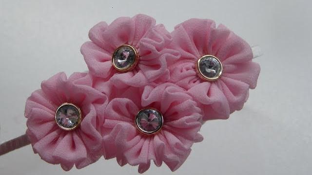 Diadema decorada con roseton de Tela