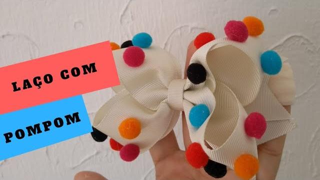 Laço com Pompom na Faixa de Bebê